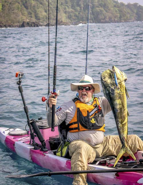 Jim Sammons kayak fishing in Panama, catching a Mahi Mahi